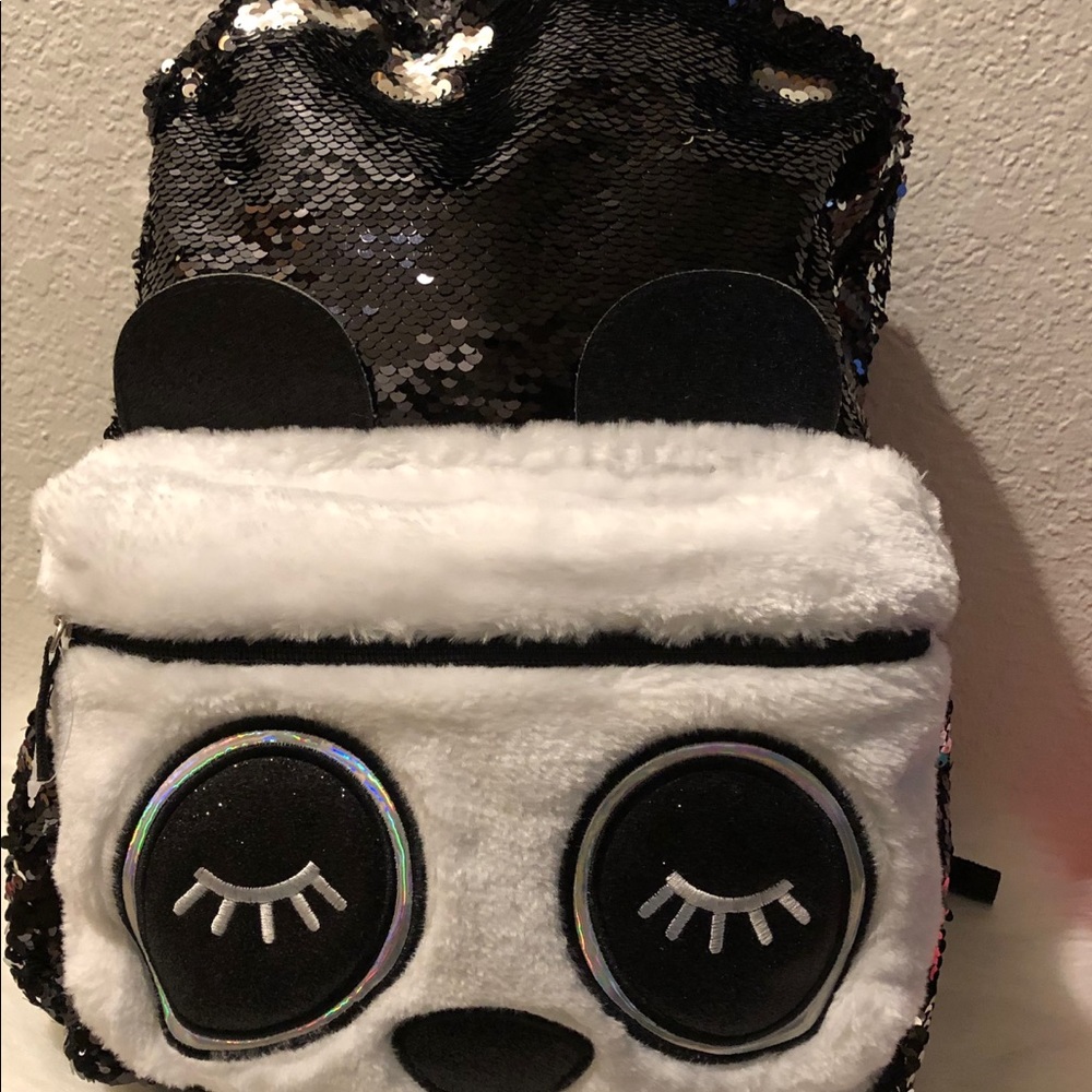 Beautiful eyes backpack with black sequins.